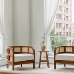 Living room scene with a pair of wooden walnut caned accent chairs with a natural vibe