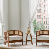 Living room scene with a pair of wooden walnut caned accent chairs with a natural vibe
