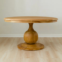 curvy solid wood round dining table with round pedestal base in mango wood