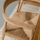 close up view of light wooden dining room chairs with jute rope woven seats
