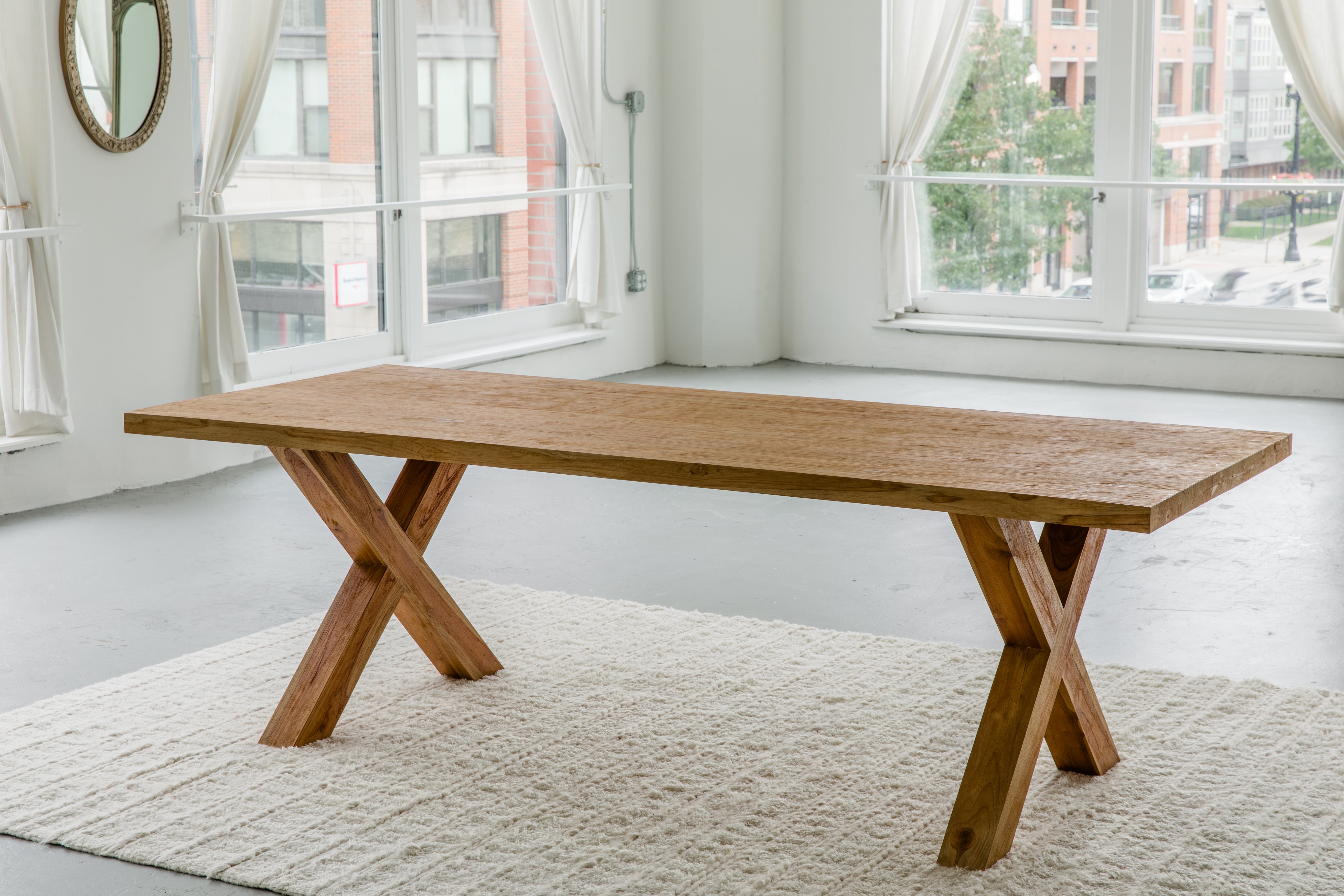 solid teak wood rectangular dining table with cross legs made from sustainable materials