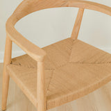 close up view of a natural light wooden chair with a jute rope woven seat that's sustainable