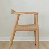 side view of a natural light wooden chair with a jute rope woven seat
