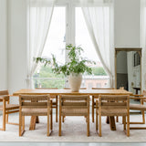 sustainable solid wood dining table and chairs in a dining room light and bright setting