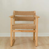 Solid teak and jute rope dining chair with arms and an intricate textural weave on the seat and back