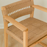 close up view of the jute rope woven seat and back of a wooden dining chair with arms