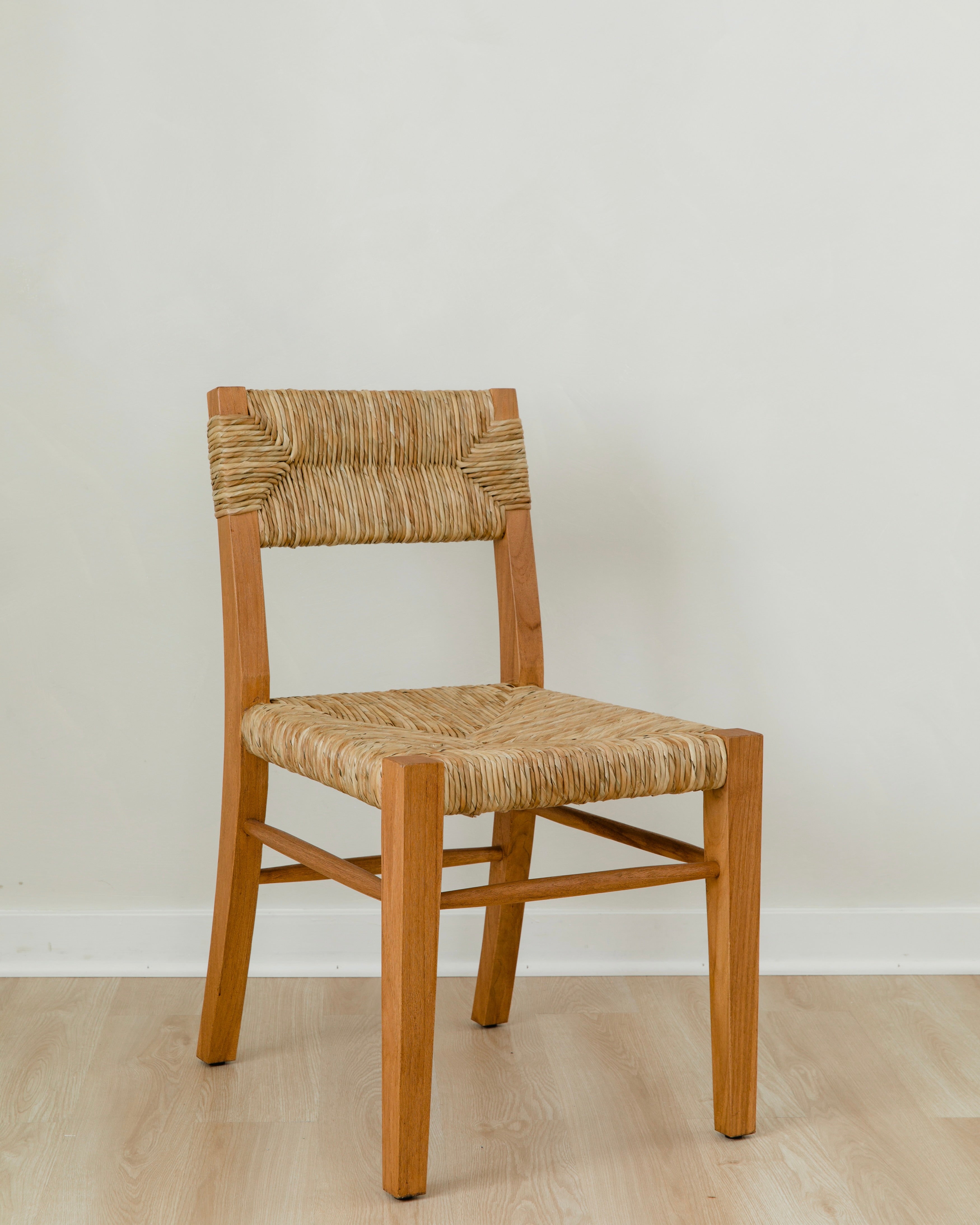angular view of classic wooden chair in a honey stain with a woven seagrass back and seat