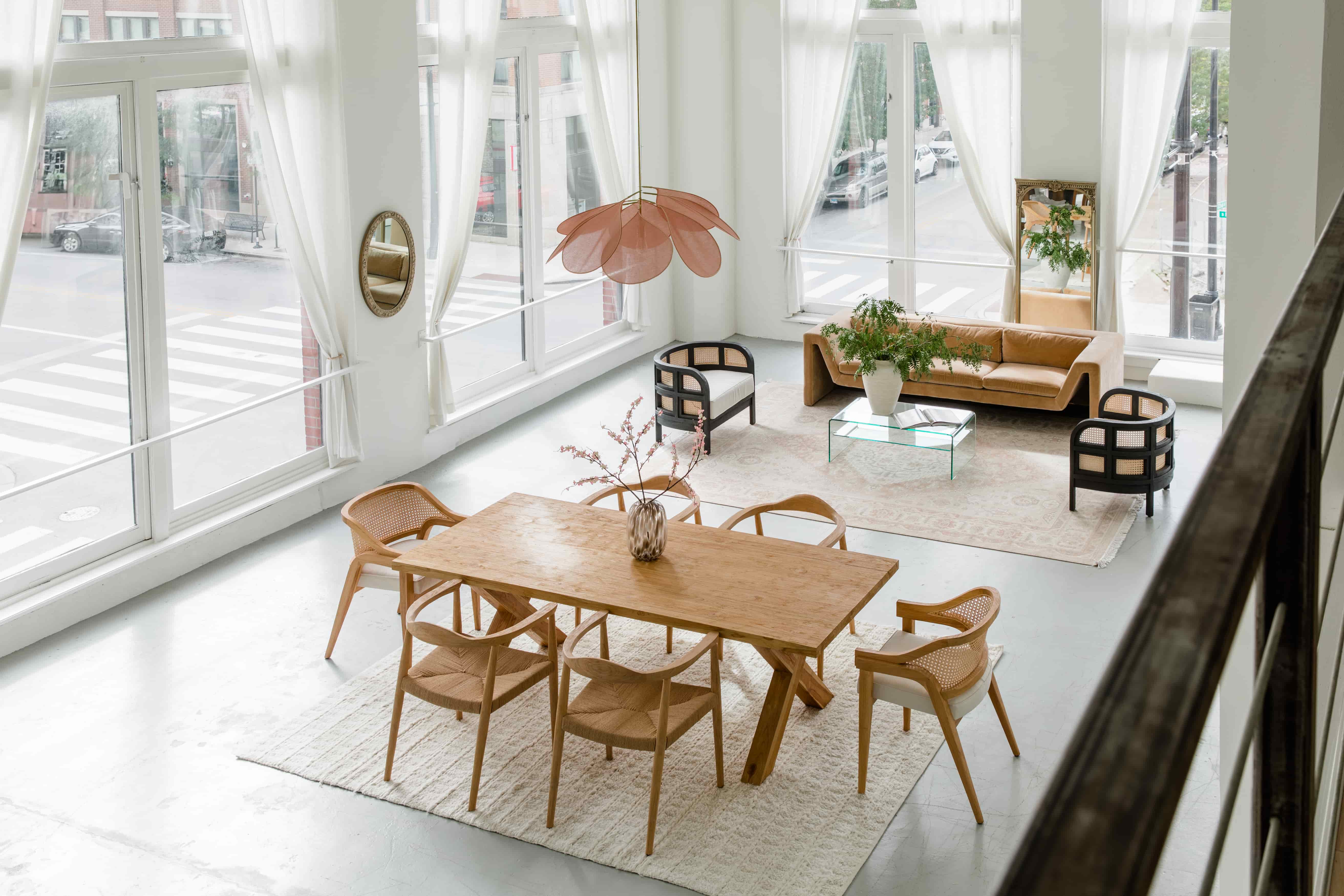 Open concept living/dining room in a modern, bright, and airy style with natural solid wood furniture