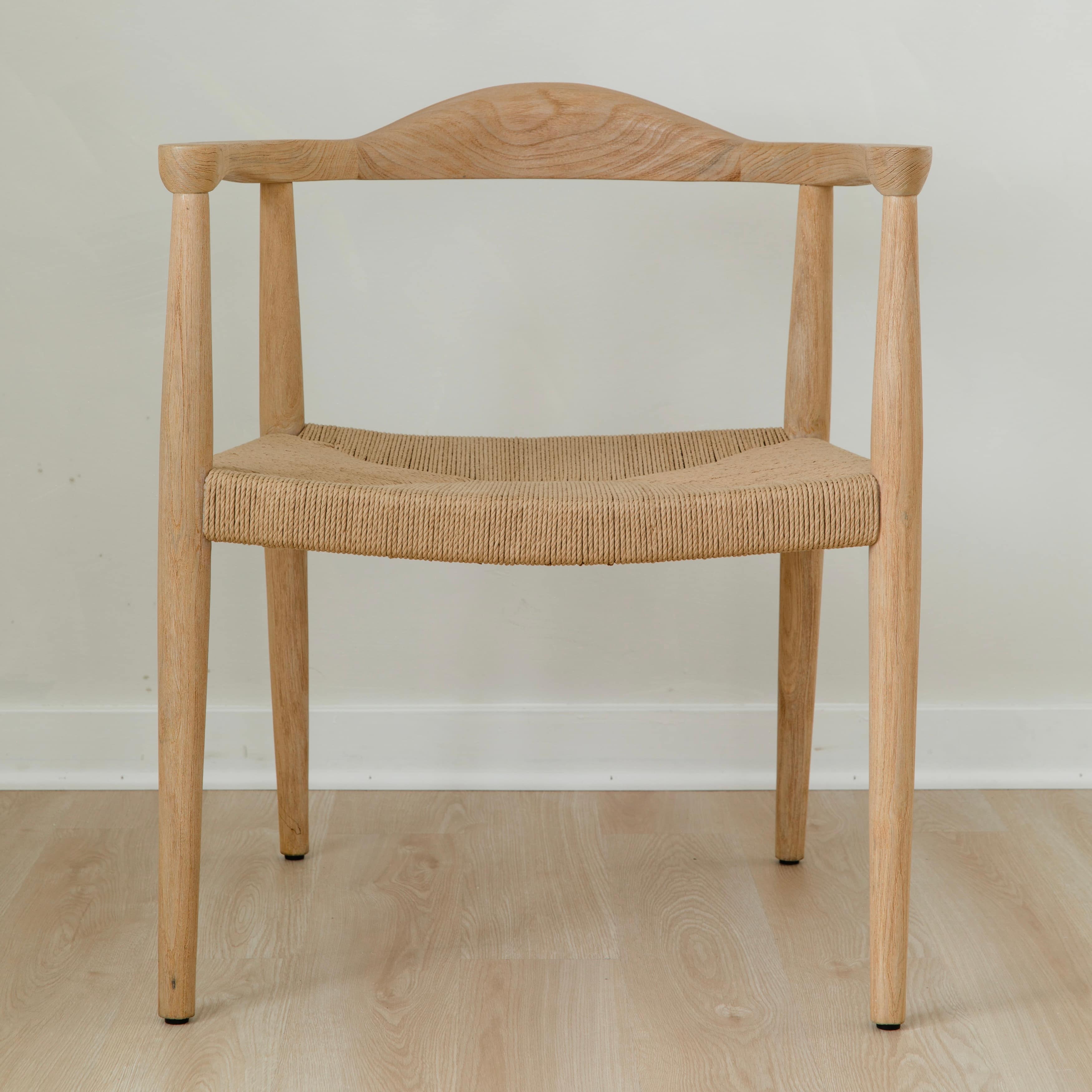 modern natural wooden dining room chair with a curved back and a jute rope woven seat