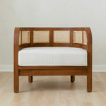 curved and caned accent chair in a club style with a walnut wooden stain finish