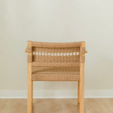 back view of a sustainable wooden dining chair with arms and a woven jute rope seat and back